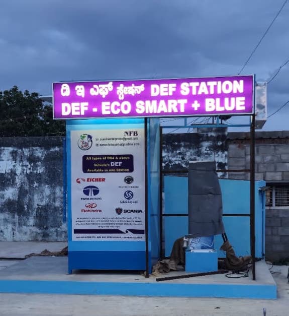 EcoSmart +Blue DEF Station outlet at Honnenahalli, Chikballapur, with lit signboard and dispensing kiosk.
